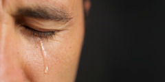 A man shedding a tear