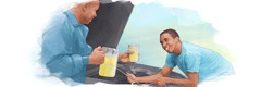 As a man works on a car, another man gives him a cold drink