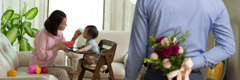 A man prepares to surprise his wife with a bouquet of flowers