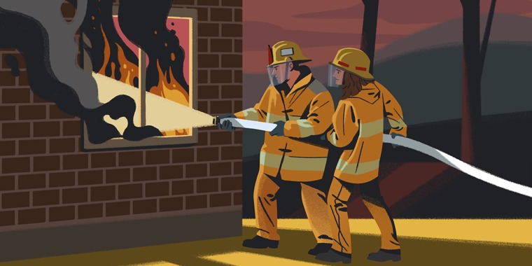 A couple works together to put out a fire