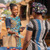 A woman handing money to a cashier to pay for groceries at an outdoor market.