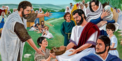Jesus mättar en stor skara med några få bröd och fiskar.