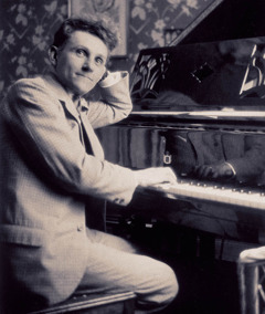 Erich Frost sitting at a piano.