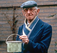 Gerrit Benink holding his tin food container.