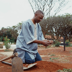 A man at a grave site