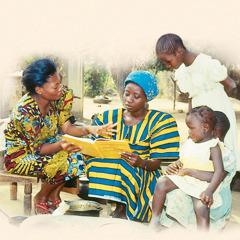 One of Jehovah’s Witnesses studies the Bible with a woman and her children