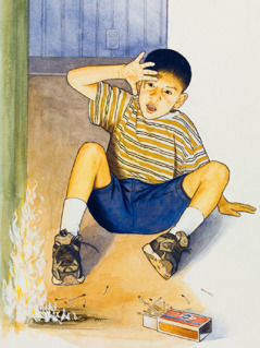 Un garçon joue avec des allumettes et met le feu