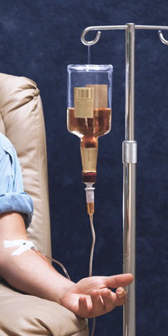 A bottle of an alcoholic beverage intravenously injected into a man’s arm
