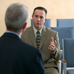 A Christian man talking to an elder