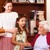A young woman and a little girl visit an elderly woman