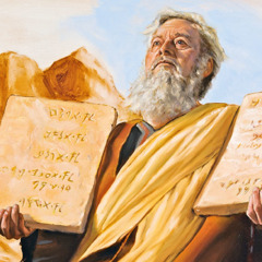 Moses holds the stone tablets containing the Ten Commandments