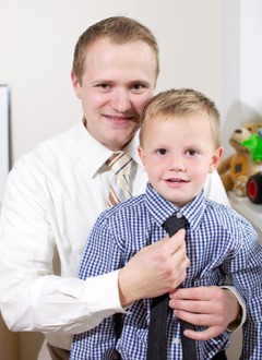 A father and son dressing for a congregation meeting
