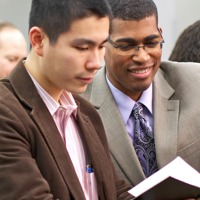 People reading the Bible at a Christian meeting