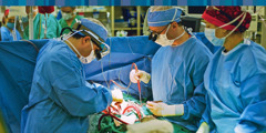 A surgical team performing a surgery in an operating room.