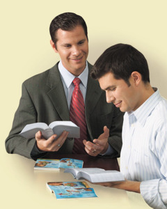 One of Jehovah’s Witnesses studies the Bible with a man