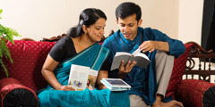 A husband and wife study the Bible together