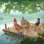 A family relaxing on a dock by a lake in an earthly paradise.