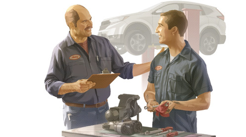 B. El jefe de un taller de autos felicitando a uno de sus mecánicos.
