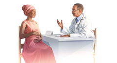 A pregnant woman talking with her doctor.