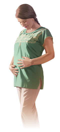 Egy terhes nő a hasát simogatja.