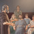 The apostle Paul sharing the good news with a group of people in a school auditorium.