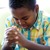 A young boy praying