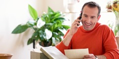 A man communicating with a friend by phone