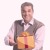 A man holds a gift-wrapped box