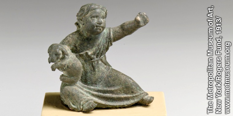 A Greek or Roman statuette of a child with a puppy