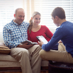A family studies the Bible together