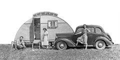 Arthur and Olive Matthews beside their car and camper trailer