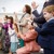 Young and old alike sing at a congregation meeting