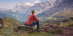 A man stares at mountains