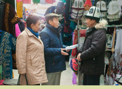 Beishenbai Berdibaev and his wife witness to a shopkeeper