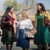 Diana greets sisters outside a Kingdom Hall