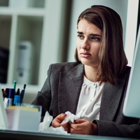A young woman cries while at work