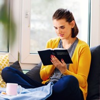 A young woman reads the Bible