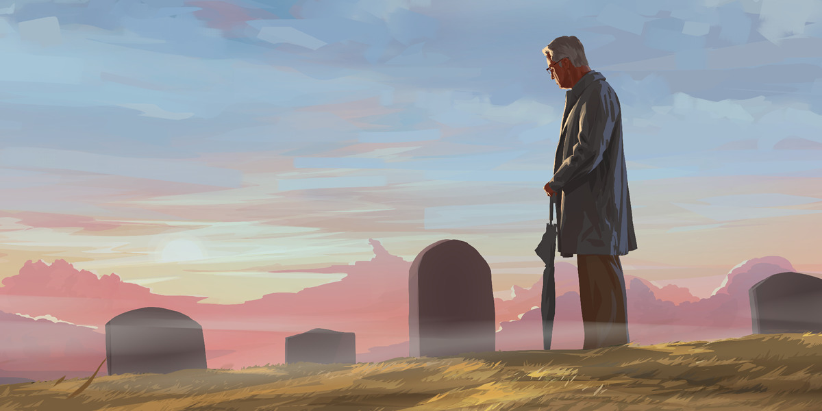 Ένας άντρας στέκεται σε νεκροταφείο