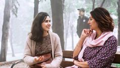 A sister casually converses with a woman on a park bench and looks for an opportunity to discuss spiritual things