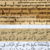 Fragment Księgi Izajasza ze Zwojów znad Morza Martwego, a poniżej współczesne arabskie tłumaczenie tej księgi.
