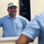 A scene from the video “How Our Brothers Are Enjoying Peace Despite Economic Problems.” Miguel looks in a mirror and smiles as he gets ready to go to work at a hardware store.