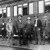 Joseph F. Rutherford and other brothers standing beside a train.
