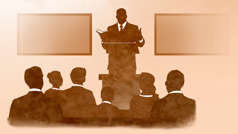 ایک بزرگ اِجلاس کے دوران تقریر کر رہا ہے۔‏
