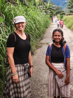 Vanessa working in the field ministry with a young local sister.