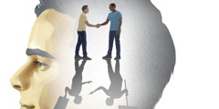 A man imagining himself shaking hands with a man of a different race. Their shadows depict them holding protest signs and arguing with each other.