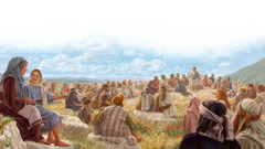 Jesus teaching a large crowd of people.