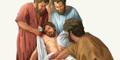 Jeesuksen opetuslapset ottavat hänen ruumiinsa paalusta ja käärivät sen kankaaseen.