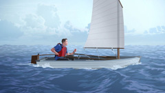 A man in a small boat with the sail unfurled.