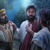 Jesus talking to his apostles at night in the garden of Gethsemane.