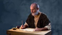 The apostle Paul writing on a scroll.